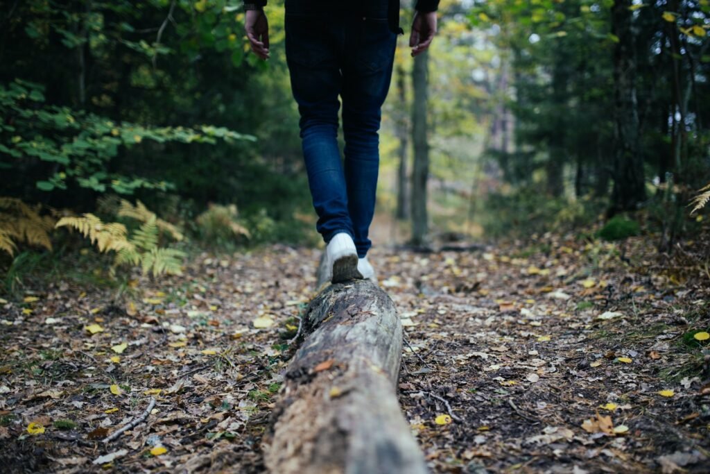 man walking on forest